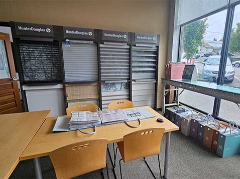 Store interior showcasing several different types of window coverings